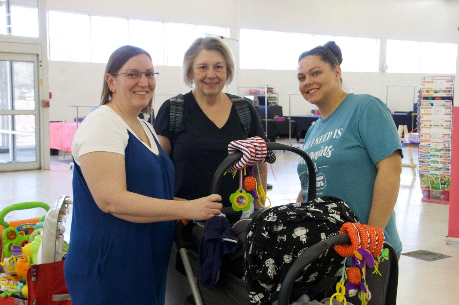 3 shoppers, 1 with a baby